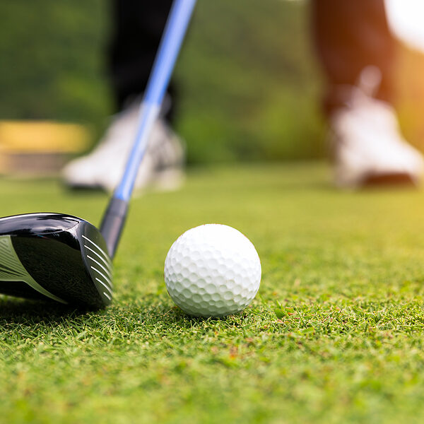 Golf Ball On Green Grass Ready To Be Struck At Golf Club,close U Golf ball on green grass ready to be struck at golf club,close up in golf coures at Thailand